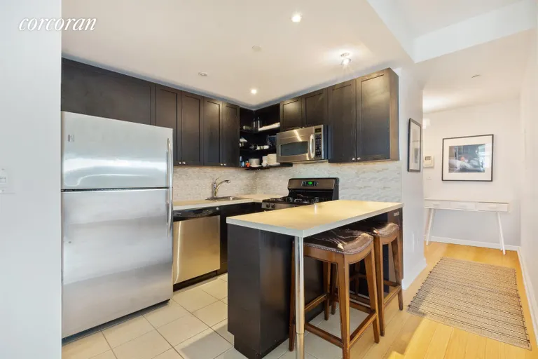 New York City Real Estate | View 145 Park Place, 4F | Stainless steel appliances and stone countertops | View 2