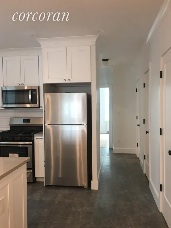 New York City Real Estate | View 243 91st Street | Kitchen with multiple closets  | View 3