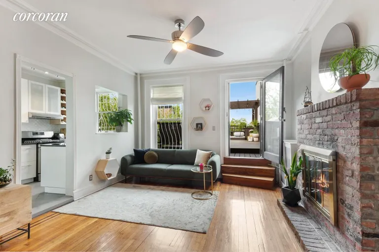 New York City Real Estate | View 50 7th Avenue, 5 | Living Room with Working Fireplace | View 3