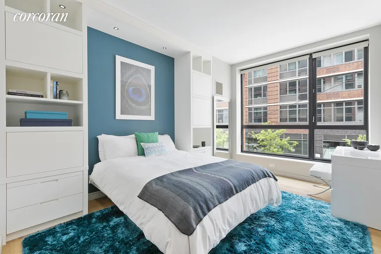 New York City Real Estate | View 540 West 28th Street, 2E | Generous Second Bedroom with Custom Built-ins | View 6