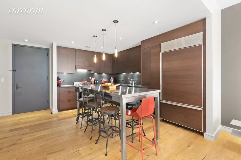 New York City Real Estate | View 540 West 28th Street, 2E | Chef's Kitchen and Dining Space | View 3