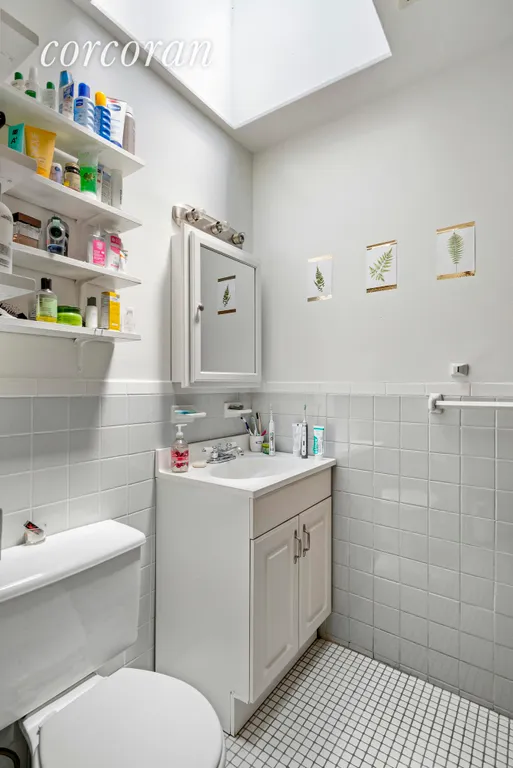 New York City Real Estate | View 251 West 21st Street, 3-4 | Full bathroom on upper level with skylight | View 7