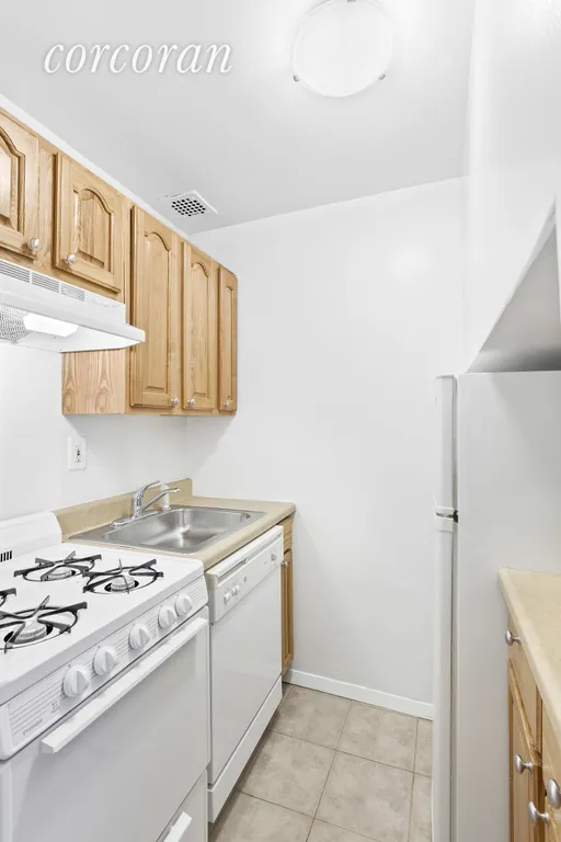 New York City Real Estate | View 310 East 23rd Street, 9C | Separate Kitchen with Dishwasher | View 2