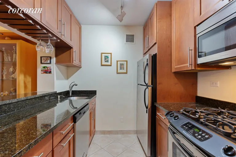 New York City Real Estate | View 343 East 74th Street, 9E | Renovated kitchen with stainless appliances | View 3