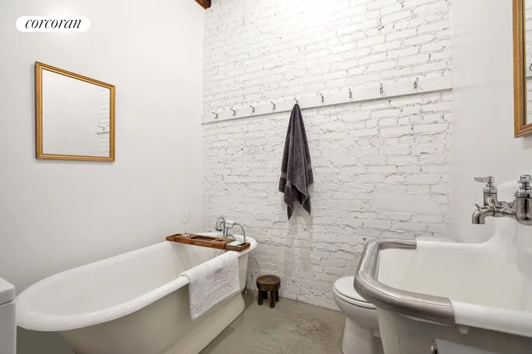 New York City Real Estate | View 711 Church Avenue | Bathroom- washer dryer in bathroom | View 4