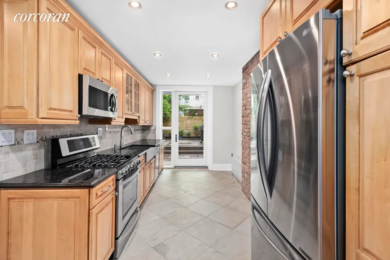 New York City Real Estate | View 215 Brooklyn Avenue, 1 | Kitchen with Brand New Appliances Access to Garden | View 2