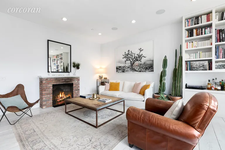New York City Real Estate | View 138 Broadway, 5G | Living room w working gas fireplace | View 6