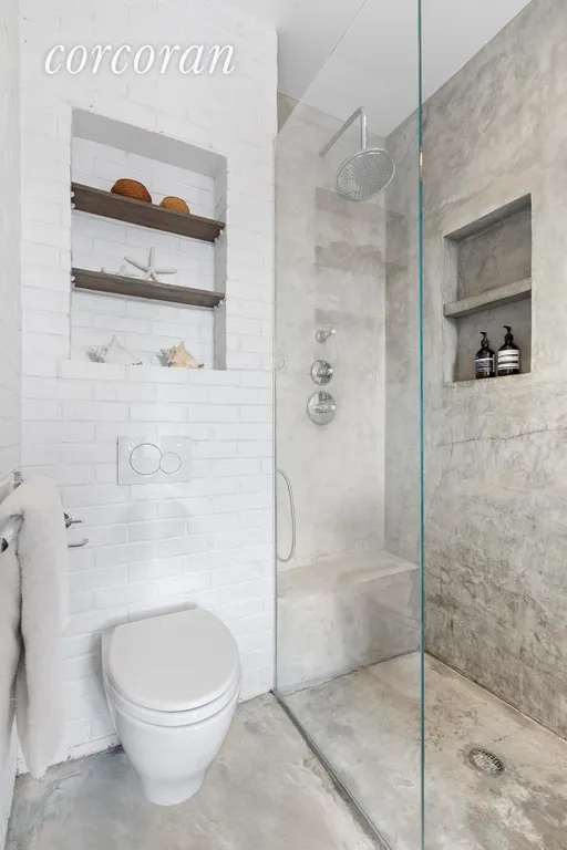 New York City Real Estate | View 138 Broadway, 5G | Poured concrete floors and glass shower stall | View 11