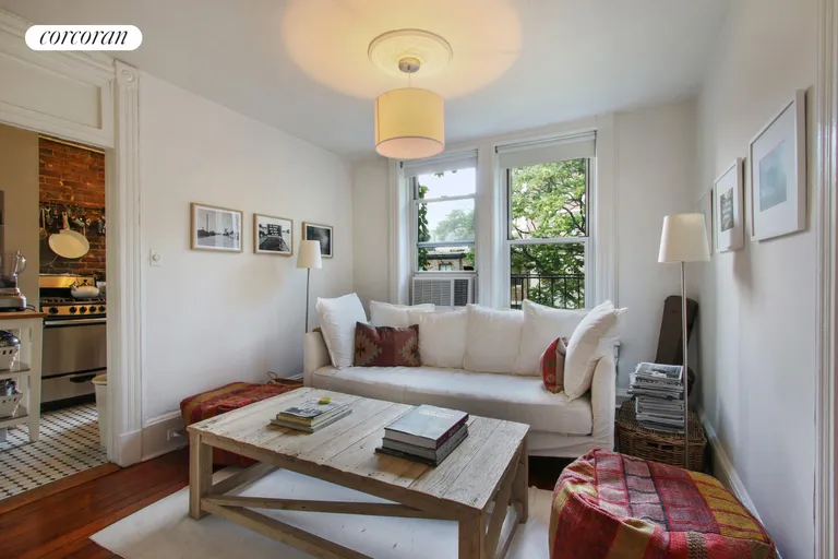New York City Real Estate | View 331 West 19th Street, PH | Cozy living room with North and South exposure | View 2
