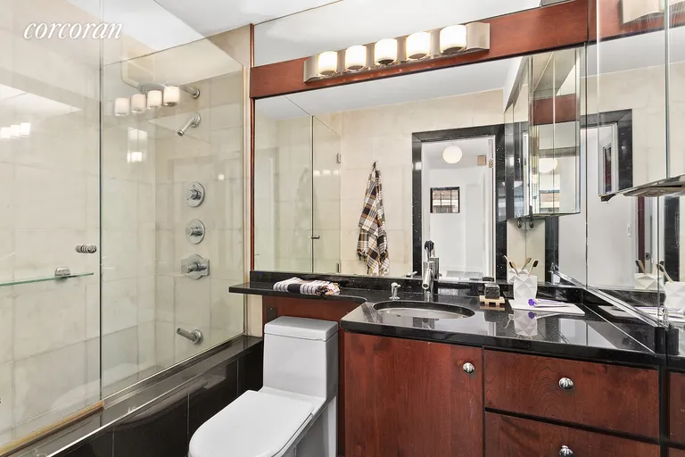 New York City Real Estate | View 222 West 14th Street, 7B | Glass and Granite Bathroom | View 6