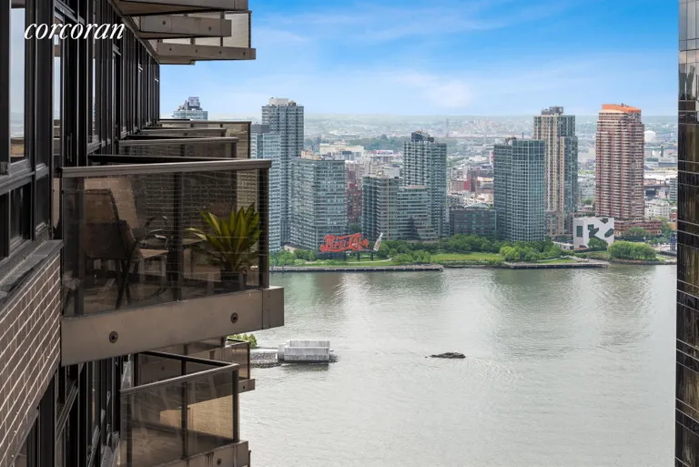 New York City Real Estate | View 100 United Nations Plaza, 42D | View from balcony to the East River and LIC | View 13