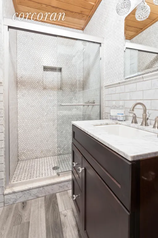 New York City Real Estate | View 233 12th Street | Renovated marble bath on parlor level | View 6