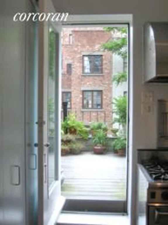 New York City Real Estate | View 333 West 70th Street, TRIPLEX | Kitchen Entrance to Terrace | View 4