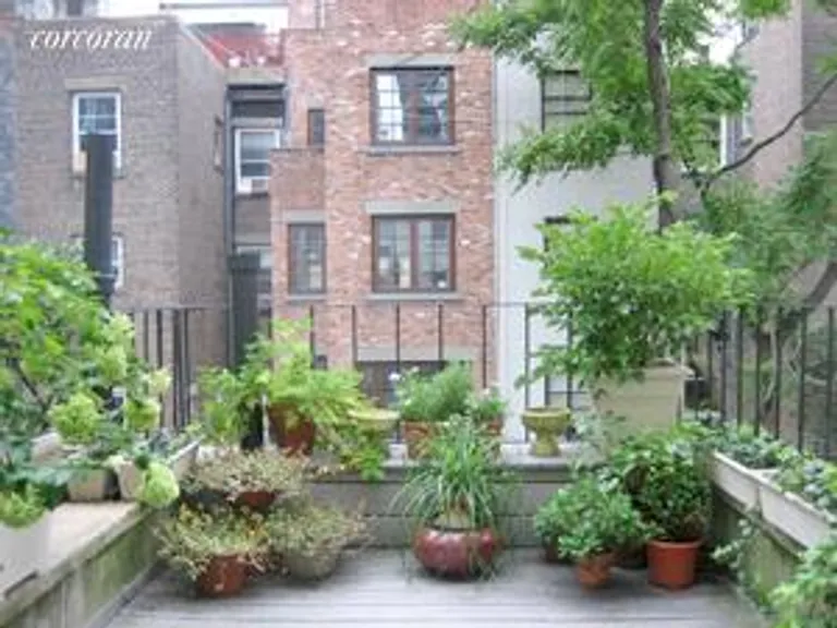 New York City Real Estate | View 333 West 70th Street, TRIPLEX | Decked Terrace off Kitchen | View 3