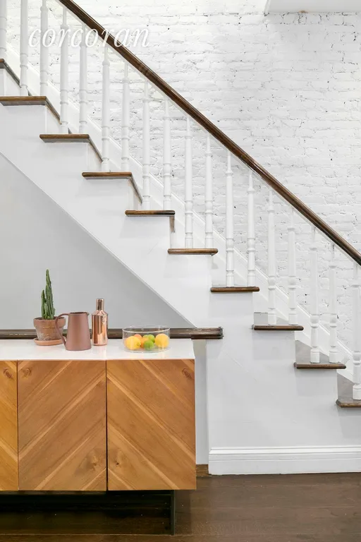 New York City Real Estate | View 436A Marion Street | Stylish exposed brick and sun drenched staircase! | View 5