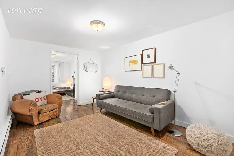 New York City Real Estate | View 436A Marion Street | Garden level living room! | View 14