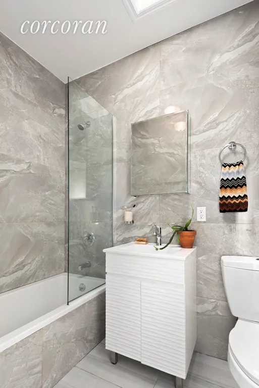 New York City Real Estate | View 436A Marion Street | Full bathroom with a skylight and a tub! | View 12