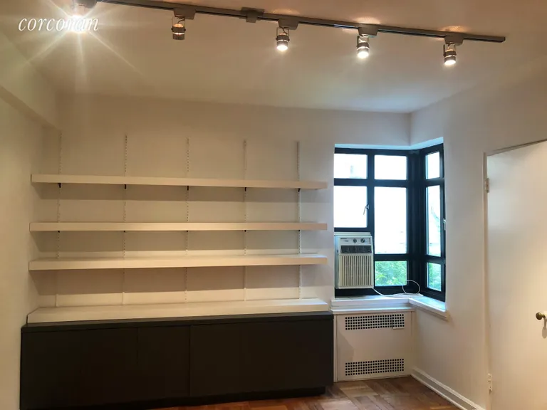 New York City Real Estate | View 100 Remsen Street, 1C | Bedroom with custom shelving | View 3