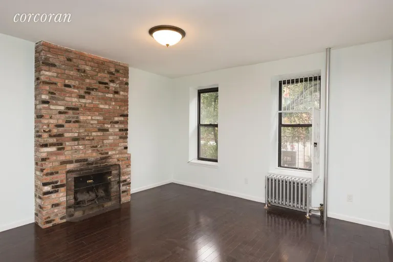 New York City Real Estate | View 2 Lincoln Place, 2F | Living Room with operable Fireplace | View 5