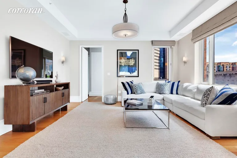 New York City Real Estate | View 21 East 96th Street, 6 | Family room | View 3