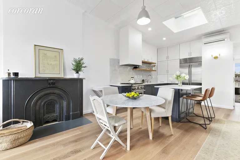 New York City Real Estate | View 86 2nd Place, 4 | Dining area with Rejuvenation light fixtures | View 9