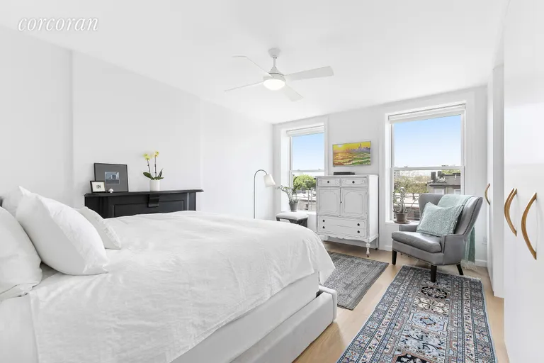 New York City Real Estate | View 86 2nd Place, 4 | Bright master bedroom with decorative fireplace | View 7