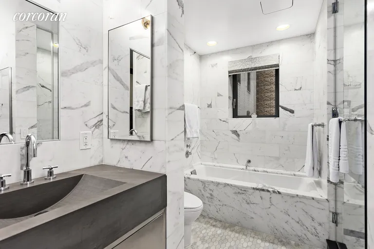New York City Real Estate | View 240 Park Avenue South, 5C | Marbled, windowed master bathroom | View 7