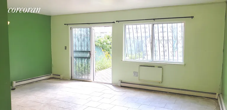 New York City Real Estate | View 3606 Boller Avenue, 1 | Living room glass sliding doors | View 2
