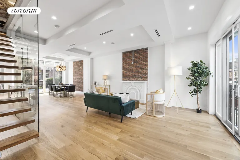 New York City Real Estate | View 154 Clifton Place | Massive Living Room with Vaulted Ceiling | View 3