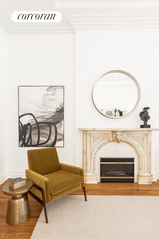 New York City Real Estate | View 121 East 38th Street | Marble surround of the decorative fireplace | View 11