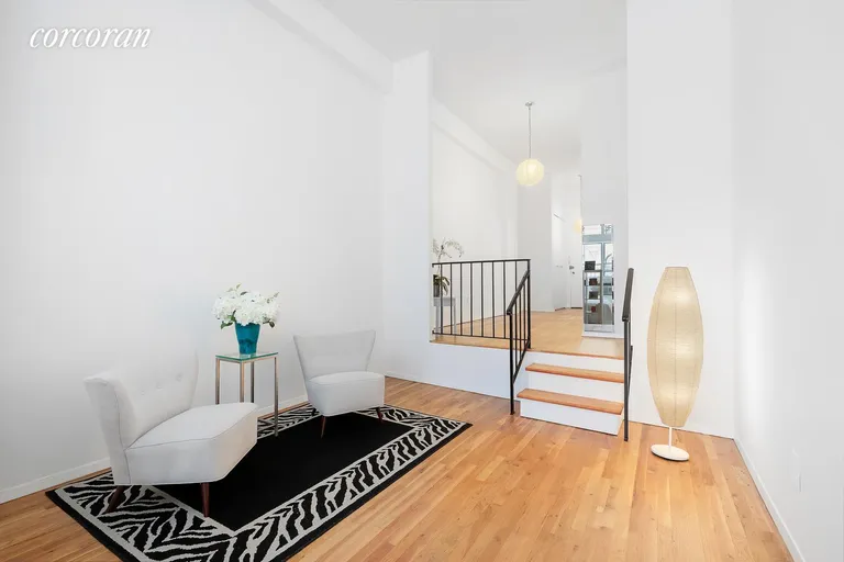 New York City Real Estate | View 23 Waverly Place, 2H | Drop Down Living Space | View 2