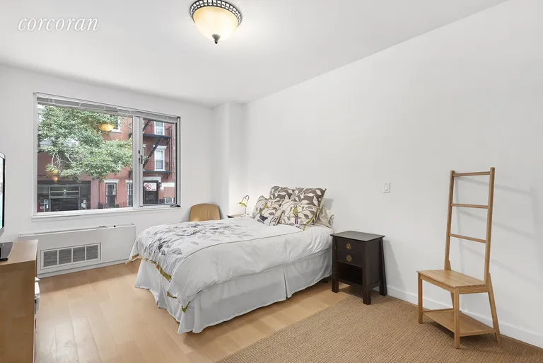 New York City Real Estate | View 517 West 46th Street, 202 | Master bedroom with ensuite bathroom | View 4