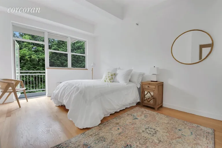 New York City Real Estate | View 324 Dean Street, 1B | Bedroom with private terrace overlooking garden | View 3