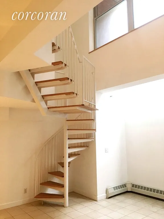 New York City Real Estate | View 324 Dean Street, 1B | Spiral Staircase to garden level | View 7