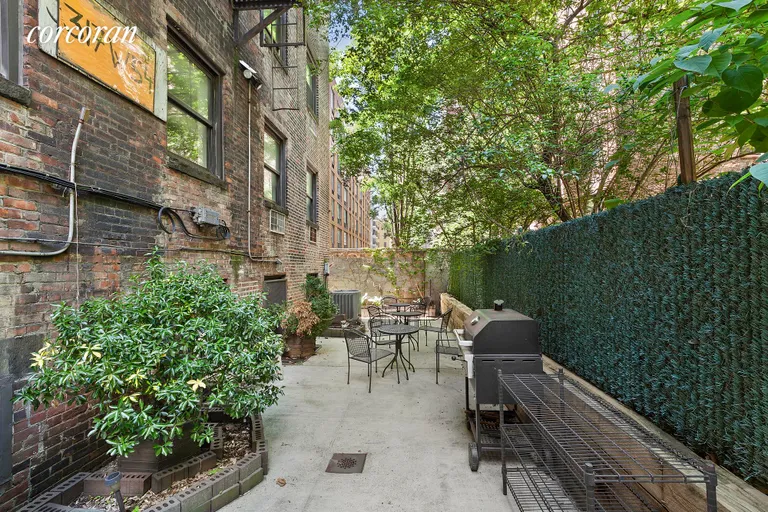 New York City Real Estate | View 317 West 54th Street, 4B | Serene landscaped garden with BBQ | View 6