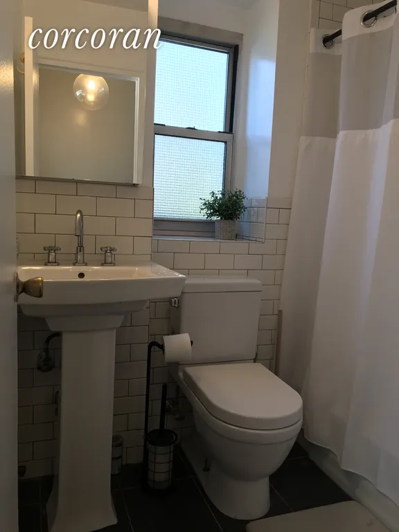 New York City Real Estate | View 77 East 12th Street, 17B | Windowed Bathroom | View 7