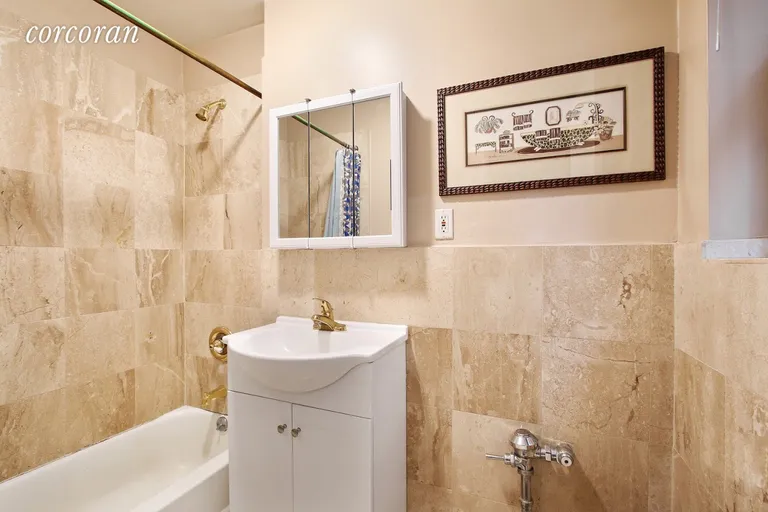 New York City Real Estate | View 142 East 49th Street, 3D | Marble Bathroom | View 2