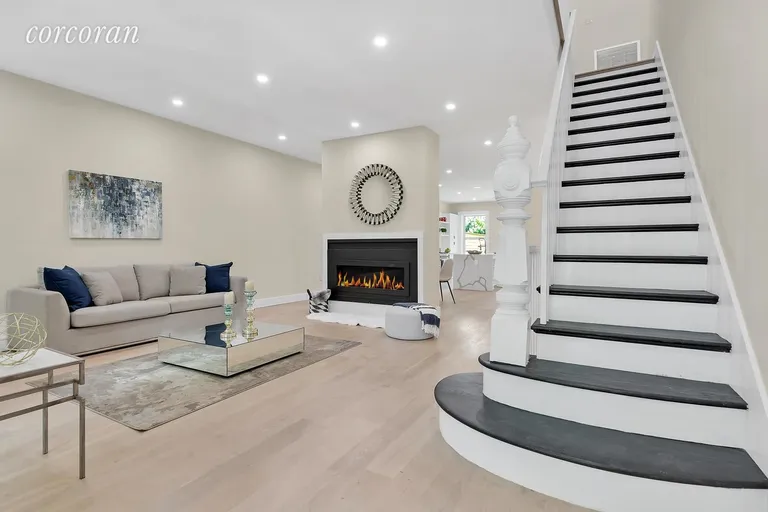 New York City Real Estate | View 47 Chauncey Street | Living Room w/ White Oak & Fireplace Detail | View 2