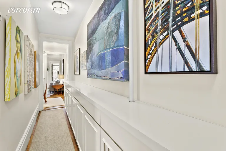 New York City Real Estate | View 606 West 113th Street, 5B | Hallway with 27+ feet of custom storage! | View 8