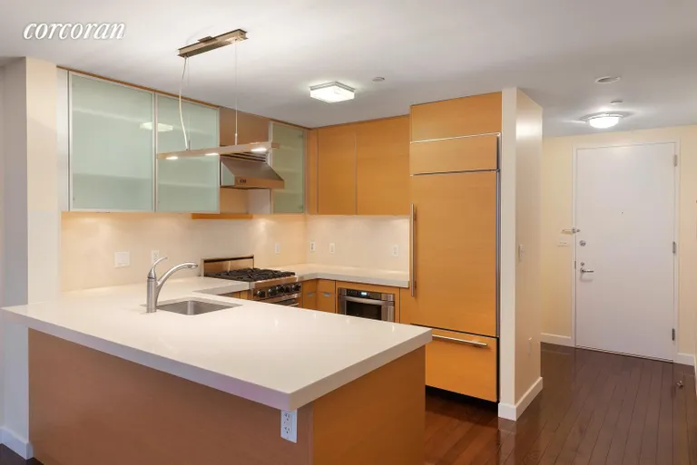 New York City Real Estate | View 462 West 58th Street, 7E | Kitchen with high-end appliances and wine fridge | View 3