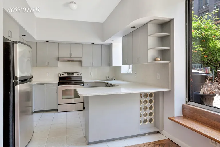 New York City Real Estate | View 212 West 15th Street, 3-4 | Open kitchen with stainless steel appliances | View 5