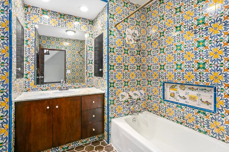 New York City Real Estate | View 230 East 11th Street, 2 | Uniquely Designed Bathroom with Beautiful Tiles | View 5