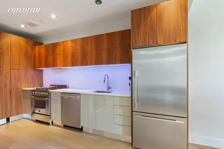 New York City Real Estate | View 131 West 122Nd Street, 2A | Open kitchen with top appliances, custom cabinets | View 2