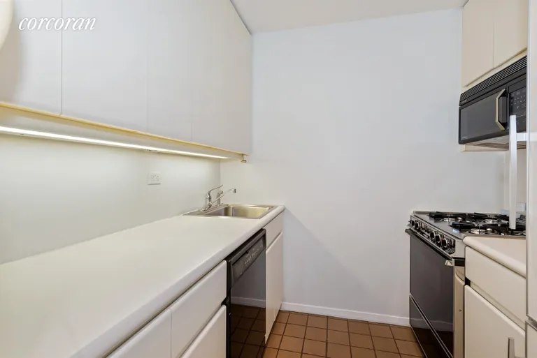 New York City Real Estate | View 100 United Nations Plaza, 5D | Galley kitchen with full size appliances | View 2