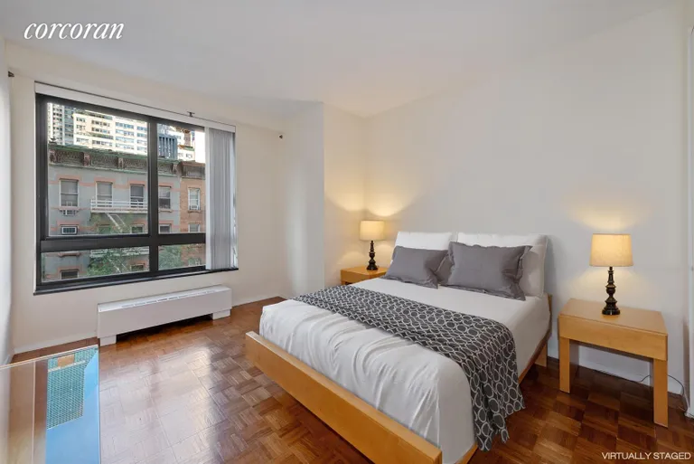 New York City Real Estate | View 100 United Nations Plaza, 5D | Large bedroom with oversized windows, virtually en | View 8