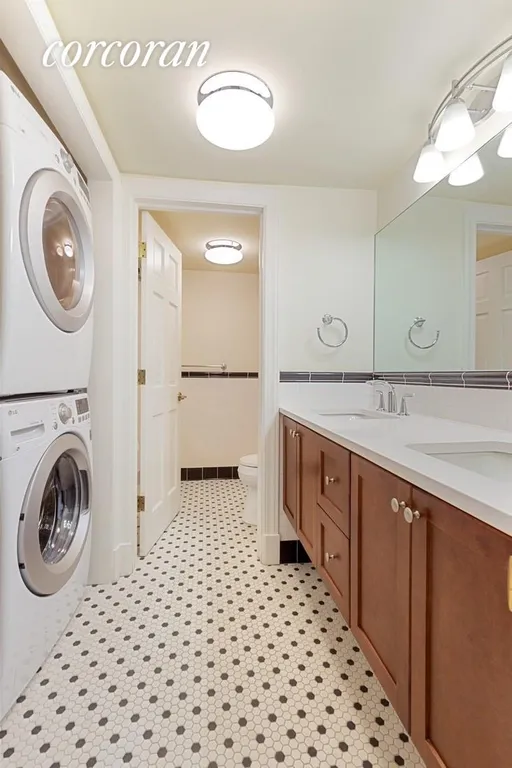 New York City Real Estate | View 489 Hudson Street, 1 | Bathroom with Laundry | View 7