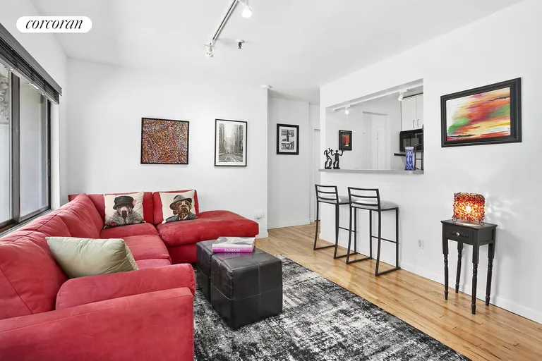 New York City Real Estate | View 67 East 11th Street, 221 | Living Room w Breakfast Bar | View 4