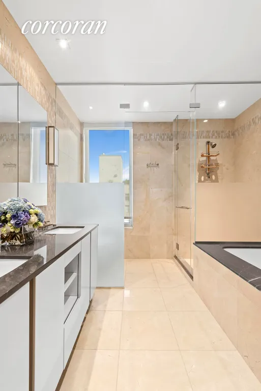 New York City Real Estate | View 255 East 74th Street, 28B | Spa-like Master Bath | View 7