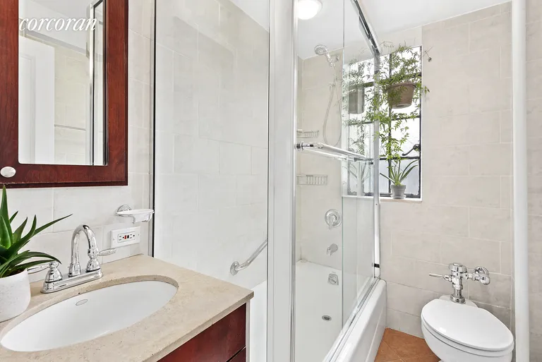 New York City Real Estate | View 333 East 43rd Street, 502 | Pristine bathroom with mirrored medicine cabinet | View 5