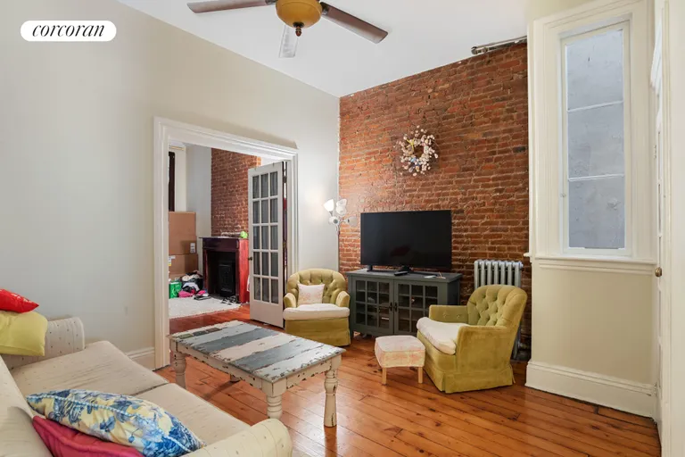 New York City Real Estate | View 127 Saint Marks Place, 1 | hardwood floors and exposed brick through out | View 2